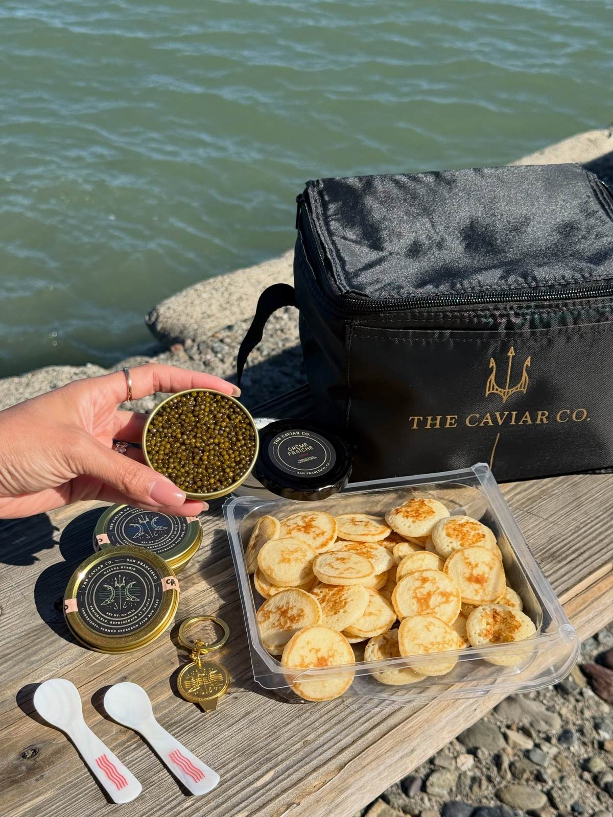 Caviar tins, blini and pearl spoons from a holiday gift set
